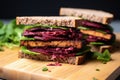 close-up of a tempeh sandwich with beetroot slices
