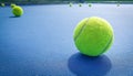 A close-up of the tennis ball on the court. The blue background is a beautiful illustration and background. Close-up shots of tenn Royalty Free Stock Photo