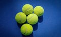A close-up of the tennis ball on the court. The blue background is a beautiful illustration and background. Close-up shots of tenn Royalty Free Stock Photo