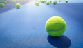 A close-up of the tennis ball on the court. The blue background is a beautiful illustration and background. Close-up shots of tenn Royalty Free Stock Photo