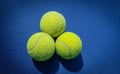 A close-up of the tennis ball on the court. The blue background is a beautiful illustration and background. Close-up shots of tenn Royalty Free Stock Photo