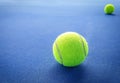 A close-up of the tennis ball on the court. The blue background is a beautiful illustration and background. Close-up shots of tenn Royalty Free Stock Photo
