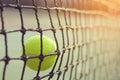 Close up tennis ball hitting to net on background Royalty Free Stock Photo