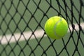 Close up tennis ball hitting to net on background Royalty Free Stock Photo