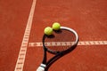 Close up of tennis balls on racket Royalty Free Stock Photo