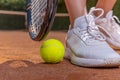 Close-up on tennis player on court, racket, ball and shoes Royalty Free Stock Photo