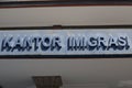 Close up of the text Kantor Imigrasi Immigration Office of Denpasar, Bali