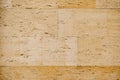 Close-up texture of beige travertine, on wall tiles.