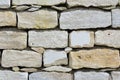 Close up and texture of a bright stone wall with joints Royalty Free Stock Photo