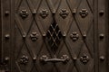 Close up texture of brown iron wrought and decorated door in european style Royalty Free Stock Photo
