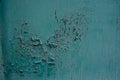 Blue cracked painting on old plaster wall surface