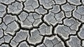 Close-up texture of cracked dry earth with a rough, weathered surface pattern Royalty Free Stock Photo