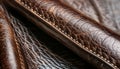 Close-up texture of dark brown leather with detailed stitching