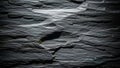 Close-up texture of dark grey slate rock with visible layers and subtle green moss 20251228 Royalty Free Stock Photo