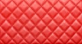 Close-up texture of genuine leather with rhombic stitching. Saturated red color Royalty Free Stock Photo