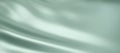 Close-up texture of light green silk. Light green fabric smooth texture surface background. Smooth elegant green silk in Sepia Royalty Free Stock Photo
