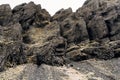 A close-up of the texture of the mountains in Iceland. Basalt volcanic rocks, puff stones covered with moss. Royalty Free Stock Photo