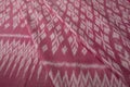 Close up of texture of pink color hand woven cotton fabric Royalty Free Stock Photo