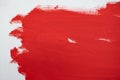 Close up Texture Red color paint on white colour canvas Brush marks stroke for paper graphic design on background Royalty Free Stock Photo