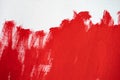 Close up Texture Red color paint on white colour canvas Brush marks stroke for paper graphic design on background Royalty Free Stock Photo