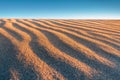 Closeup texture of the rippled surface of the sand and dunes, top view. Desert background Royalty Free Stock Photo