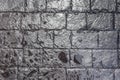Close up texture of wet black brick wall background. Royalty Free Stock Photo