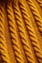 Close-up texture of a yellow knitted woolen sweater