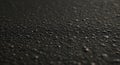 Close-up of a textured asphalt surface, featuring a dark, granular composition with sm Royalty Free Stock Photo