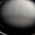Close up of a textured black surface displaying a fine pebbled pattern Royalty Free Stock Photo
