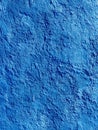 Close-up of textured blue wall surface with rough finish Royalty Free Stock Photo