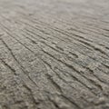 Close-up of textured concrete with parallel grooves running across the surface. The Royalty Free Stock Photo