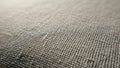 Close up of a textured grey fabric showcasing a tight weave pattern Royalty Free Stock Photo