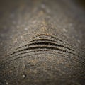 Close-up of a textured, layered structure resembling sand or sediment, with fine Royalty Free Stock Photo