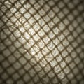 Close-up of a textured mesh fabric with interlocking fibers, creating a grid pattern. The Royalty Free Stock Photo