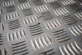Close-Up of Textured Metal Tread Plate with Diamond Pattern for Industrial Flooring Royalty Free Stock Photo