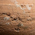 Close-up of a textured pottery surface, showcasing a reddish-brown clay material. Th Royalty Free Stock Photo