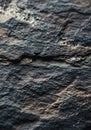 Close-up of a textured rock surface, displaying rough, uneven patterns and varying Royalty Free Stock Photo