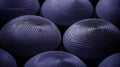 Close-up of textured spherical objects in a deep violet hue creating an abstract pattern Royalty Free Stock Photo