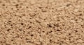 Close-up of a textured surface resembling cork, characterized by a coarse, irregular Royalty Free Stock Photo
