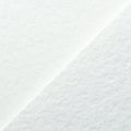 Close-up of textured white paper with diagonal light and shadow pattern Royalty Free Stock Photo