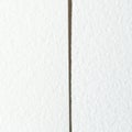 Close-up of textured white paper with vertical fold line in center Royalty Free Stock Photo