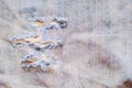 Close up of Textures ripped torn denim light blue jeans textile fabric background Royalty Free Stock Photo