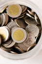 Close up Thai baht coin in the glass jar select focus shallow depth of field Royalty Free Stock Photo