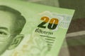Close up of Thai banknote Thai bath with the image of Thai King. Thai banknote of 20 Thai baht on Green Scottish fabric. Royalty Free Stock Photo