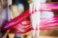 Close up of Thai Silk weaving on a traditional loom. Royalty Free Stock Photo