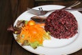 Steamed riceberry rice on a plate