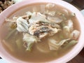 Thai tamarind soup with fish and coconut shoot