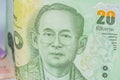 Close up of thailand currency, thai baht with the images of Thailand King. Denomination of 20 bahts