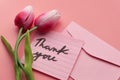 Close up of thank you message, envelope and flower Royalty Free Stock Photo