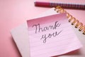 Close up of thank you message, envelope on pink Royalty Free Stock Photo